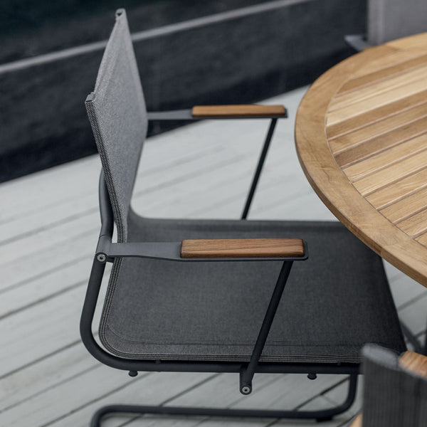 Sway stacking chair with arms